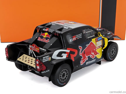 Toyota GR Dkr Hilux Team Toyota Gazoo Racing N°206 Rally Dakar 2024 Lucas Moraes - Armand Monleon 1:18 IXO Models čierna žltá červená